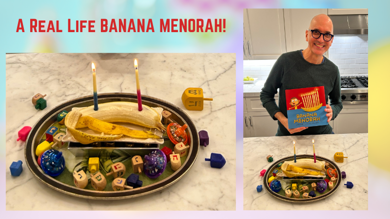 With the text "A Real Life Banana Menorah!" a photo of Lee Wind, holding the Banana Menorah picture book, with a peeled banana on a tray with two lit candles - the first night of Hanukkah! 